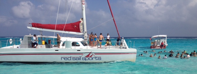 Group enjoying a catamaran sailing excursion on an incentive travel program